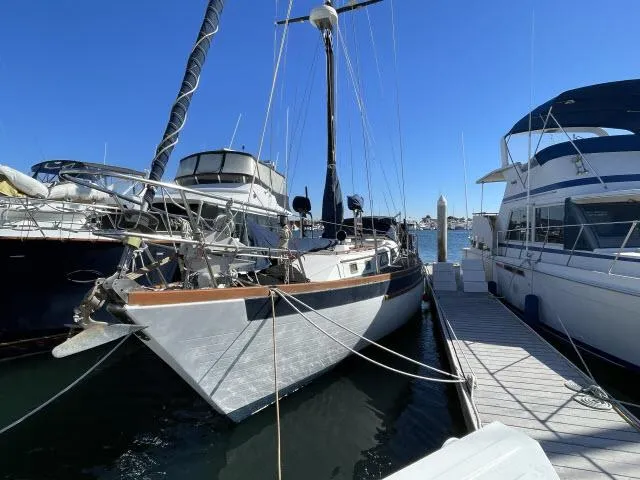 Slide: The Image of 1982 Formosa 42 sailboat docked at marina on a sunny day. - 17