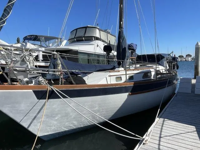 Slide: The Image of 1982 Formosa 42 sailboat docked at marina on a sunny day. - 18