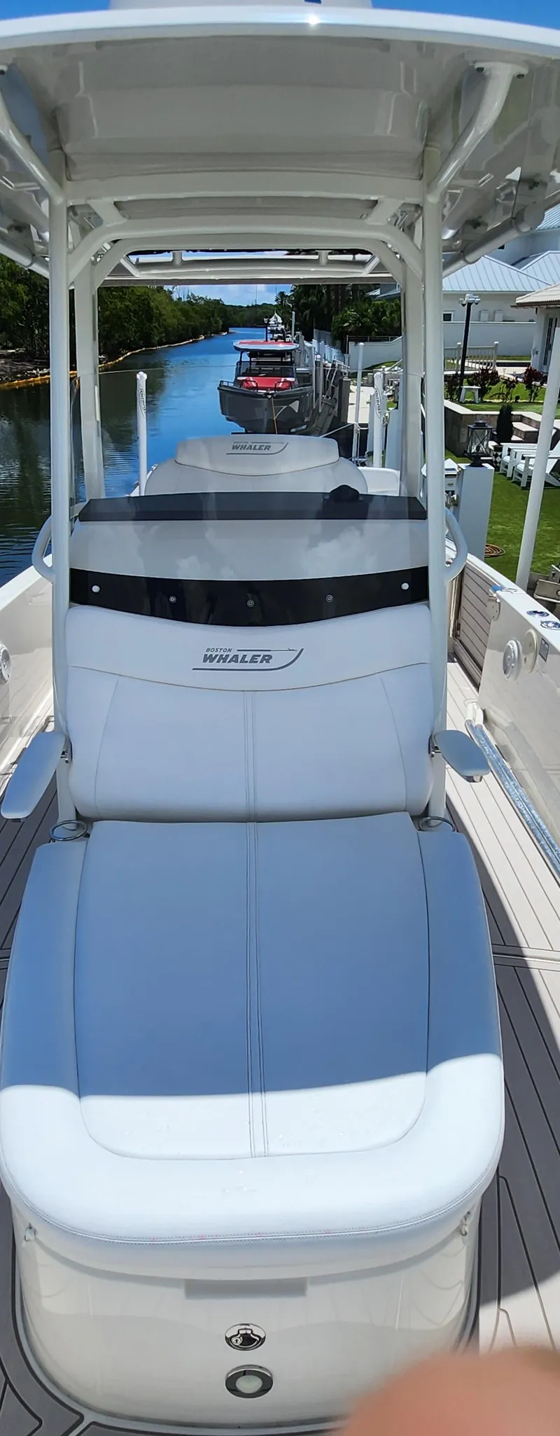 Slide: The Image of 2021 Boston Whaler Dauntless 27 boat on a sunny day by the water. - 11