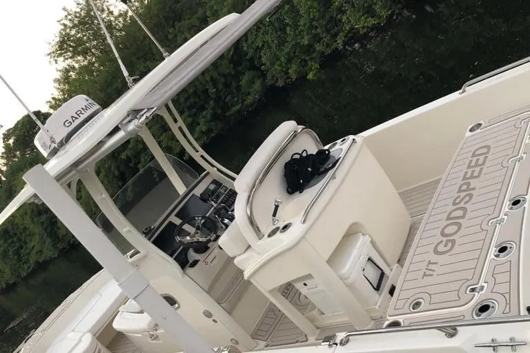 Slide: The Image of 2021 Boston Whaler Dauntless 27 boat interior with Garmin equipment and TT Godspeed mat. - 12