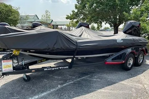 Slide: The Image of 2023 Ranger Z519 boat covered on a trailer in a parking lot. - 5