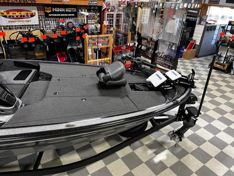 Slide: The Image of 2023 Nitro Z19 Pro fishing boat displayed in a showroom with fishing gear. - 3