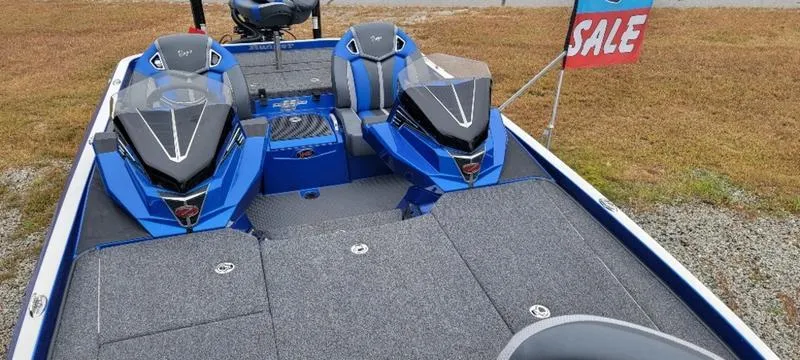 Slide: The Image of 2023 Ranger Z 521 RC boat for sale, blue interior, dual seats, outdoor display. - 10