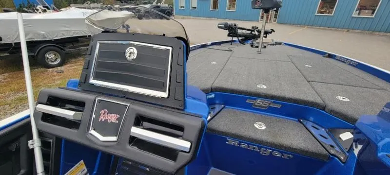 Slide: The Image of 2023 Ranger Z 521 RC boat interior with control panel and seating area. - 12