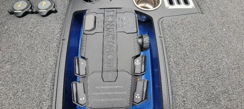 Slide: The Image of 2023 Ranger Z 521 RC boat dashboard with Lowrance electronics and cup holder. - 4