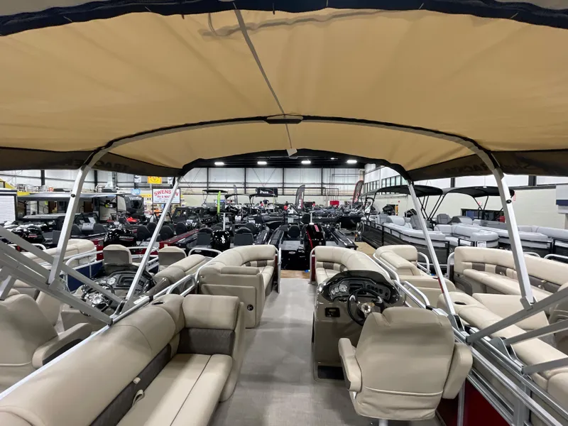 Slide: The Image of 2023 Sun Tracker Party Barge 20 DLX pontoon boat interior in showroom. - 11