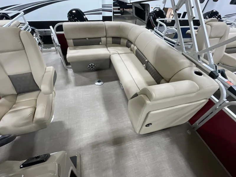 Slide: The Image of 2023 Sun Tracker Party Barge 20 DLX interior with beige seating and modern design. - 6