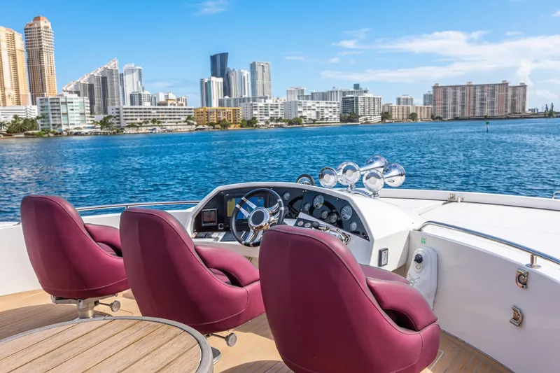 Slide: The Image of Luxurious Sunseeker Predator 84 yacht helm with city skyline view, 2013 model. - 17