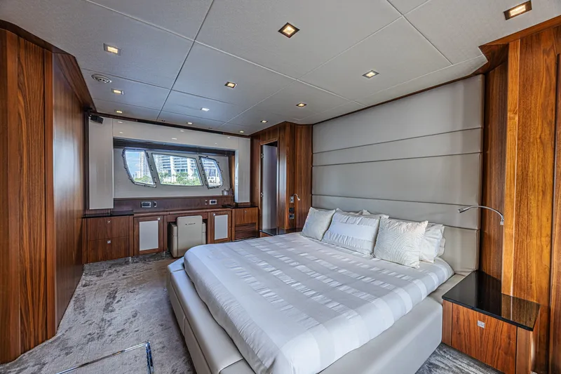Slide: The Image of Luxurious bedroom interior of 2013 Sunseeker Predator 84 yacht with elegant wood paneling. - 41