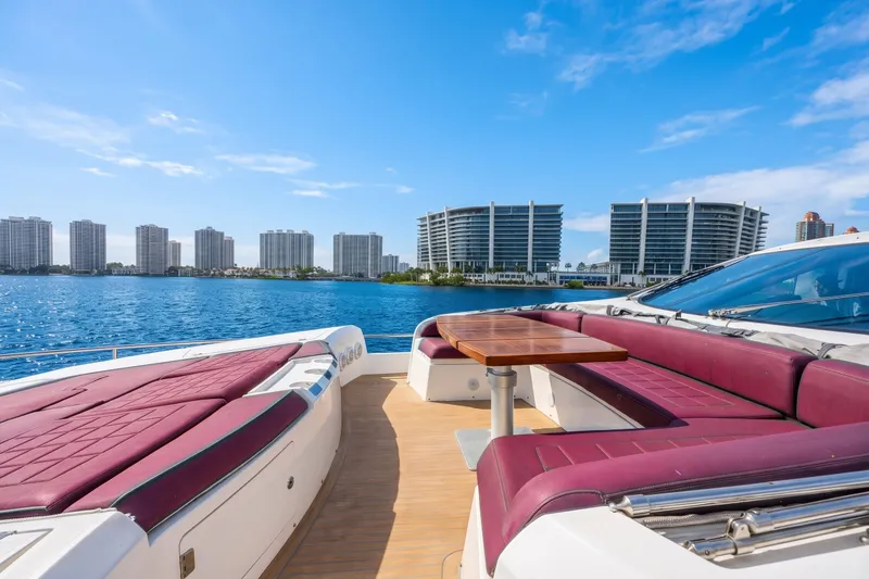 Slide: The Image of Luxurious Sunseeker Predator 84 yacht with spacious deck, overlooking waterfront cityscape. - 25