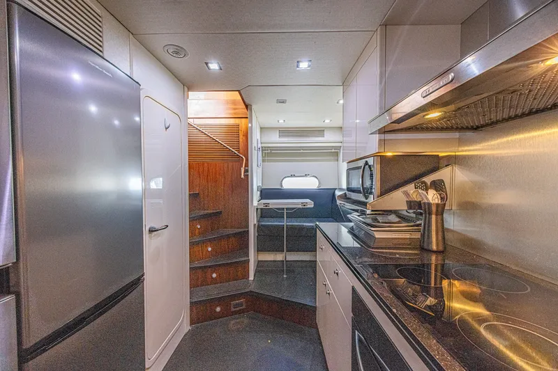 Slide: The Image of Luxurious interior of 2013 Sunseeker Predator 84 yacht with modern kitchen and seating area. - 61