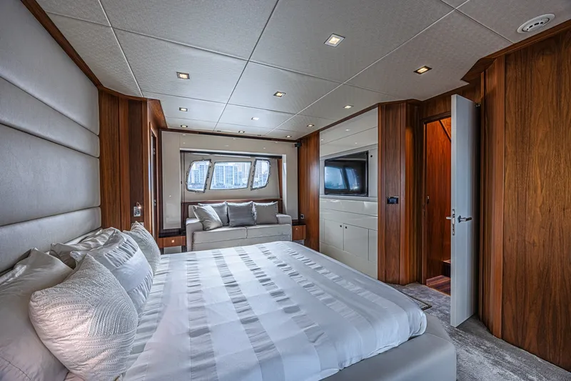 Slide: The Image of Luxurious bedroom interior of 2013 Sunseeker Predator 84 yacht with elegant wood paneling. - 45