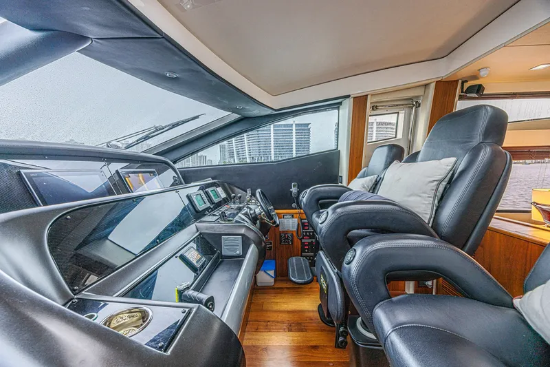 Slide: The Image of Luxurious interior of 2013 Sunseeker Predator 84 yacht cockpit with leather seating and control panels. - 37