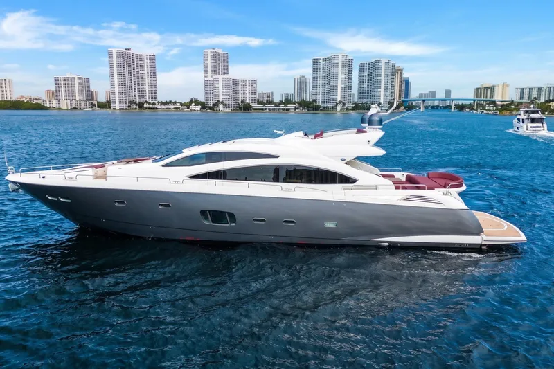 The Image of Luxury 2013 Sunseeker Predator 84 yacht cruising near city skyline. - 0