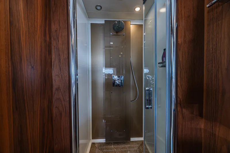 Slide: The Image of Luxurious shower in 2013 Sunseeker Predator 84 yacht with wood accents and modern fixtures. - 49