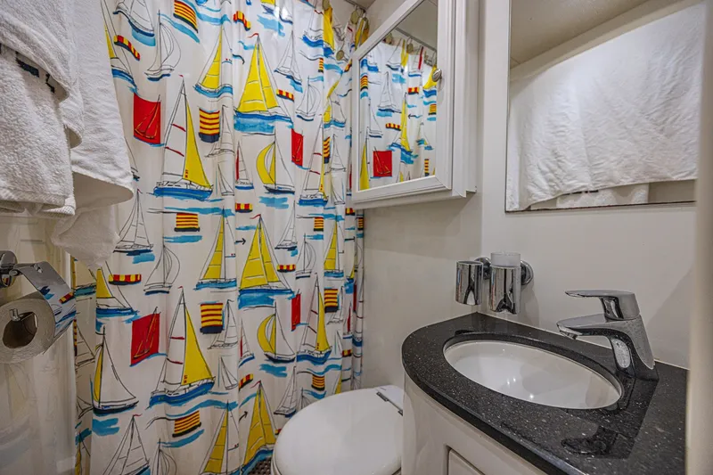 Slide: The Image of Bathroom in 2013 Sunseeker Predator 84 yacht with nautical-themed shower curtain. - 63