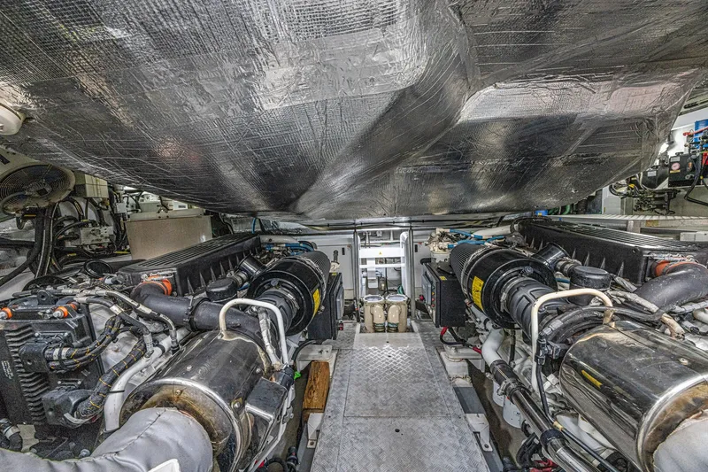 Slide: The Image of Engine room of 2013 Sunseeker Predator 84 yacht, showcasing dual engines and mechanical components. - 67