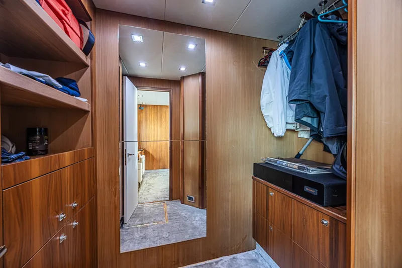 Slide: The Image of Luxurious wooden interior of 2013 Sunseeker Predator 84 yacht with closet and mirror. - 48