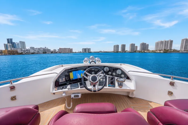 Slide: The Image of Helm of 2013 Sunseeker Predator 84 yacht with city skyline view. - 22