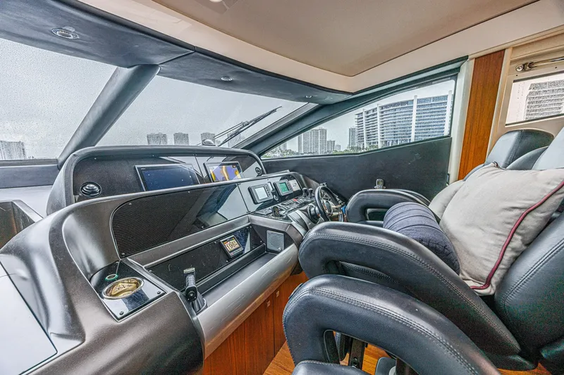 Slide: The Image of Luxurious interior of 2013 Sunseeker Predator 84 yacht cockpit with modern controls. - 39