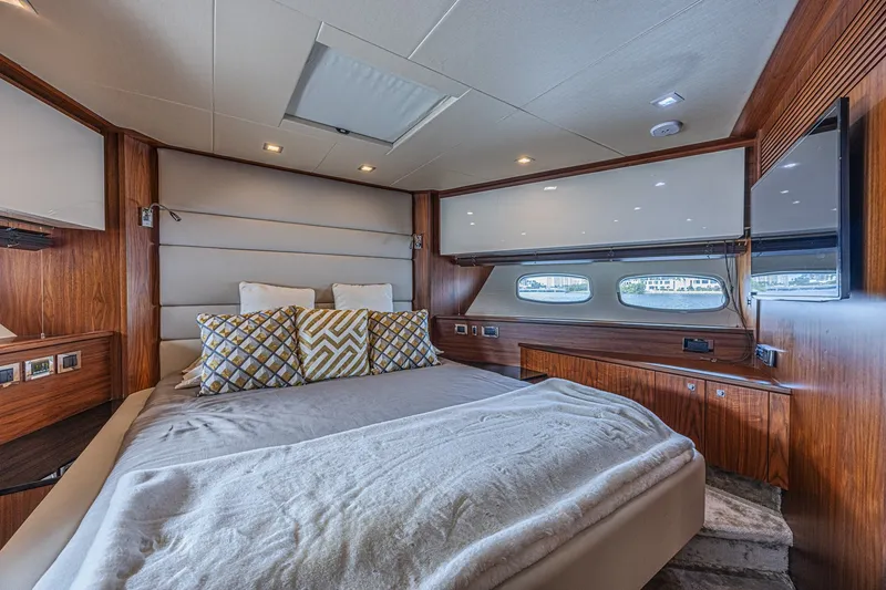 Slide: The Image of Luxurious bedroom interior of 2013 Sunseeker Predator 84 yacht with elegant wood finishes. - 52