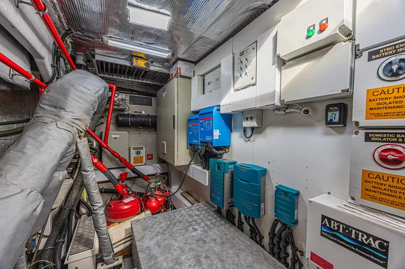 Slide: The Image of Engine room of 2013 Sunseeker Predator 84 yacht with control panels and safety equipment. - 68