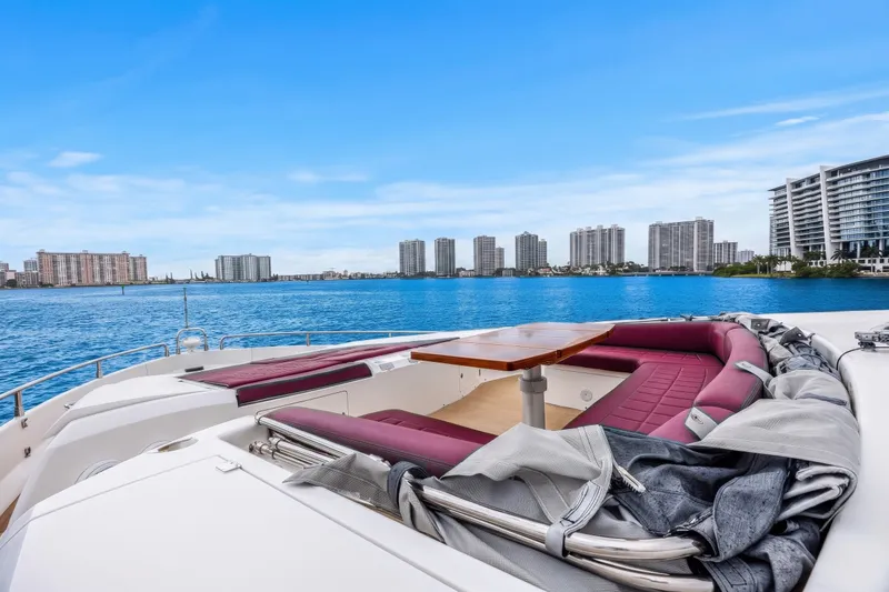 Slide: The Image of Luxurious 2013 Sunseeker Predator 84 yacht with spacious deck seating, overlooking waterfront skyline. - 21