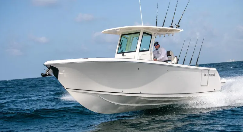 Slide: The Image of 2023 Sailfish 272 CC boat cruising on open water. - 5