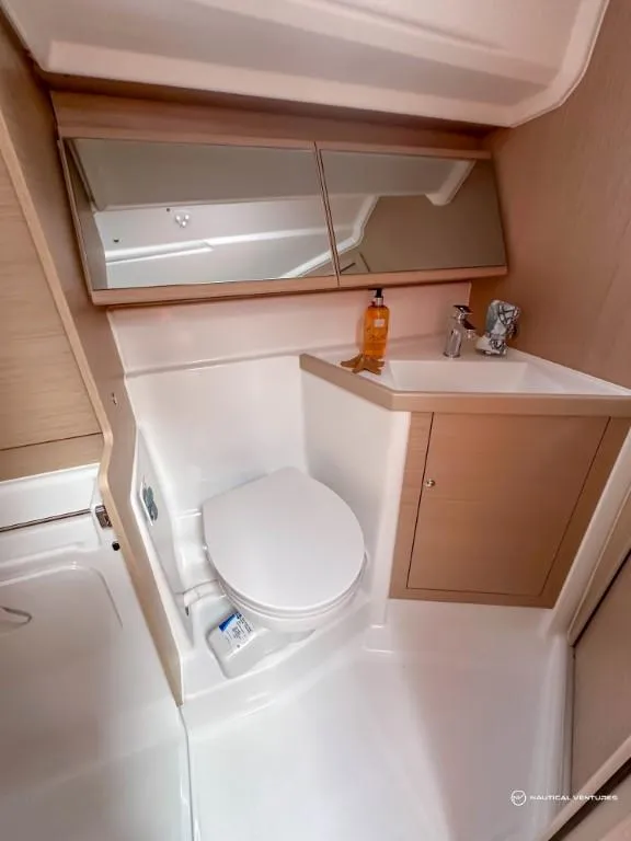 Slide: The Image of Modern bathroom in 2024 Beneteau Oceanis 40.1 sailboat with toilet and sink. - 17