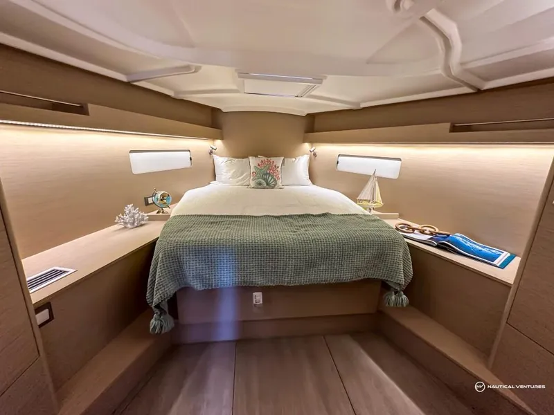 Slide: The Image of Luxurious bedroom in 2024 Beneteau Oceanis 40.1 yacht with cozy bed and elegant decor. - 2