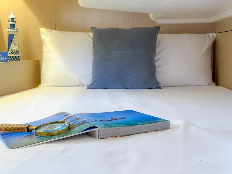 Slide: The Image of Cozy cabin bed in 2024 Beneteau Oceanis 40.1 yacht with nautical decor. - 22