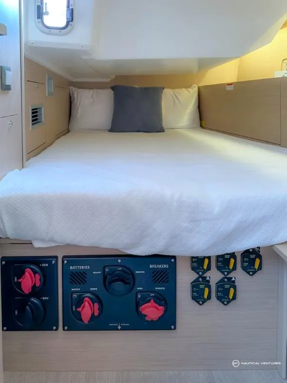 Slide: The Image of 2024 Beneteau Oceanis 40.1 cabin with control panel and cozy bed. - 26