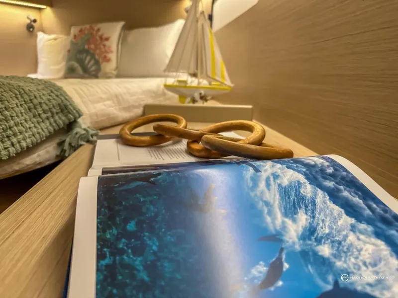 Slide: The Image of Cozy cabin interior of 2024 Beneteau Oceanis 40.1 with nautical decor. - 3