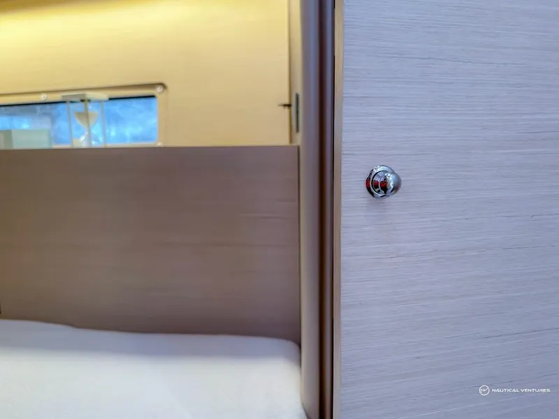 Slide: The Image of Interior cabin of 2024 Beneteau Oceanis 40.1 sailboat with modern wood finish. - 30