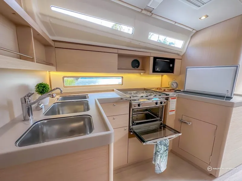 Slide: The Image of Modern kitchen in 2024 Beneteau Oceanis 40.1 yacht with double sink and stove. - 34