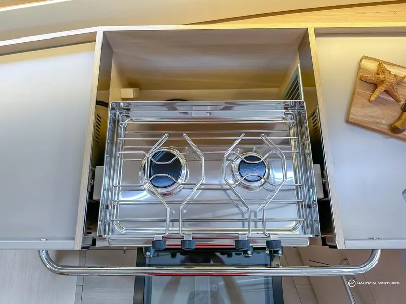 Slide: The Image of Modern kitchen stove on the 2024 Beneteau Oceanis 40.1 yacht. - 38