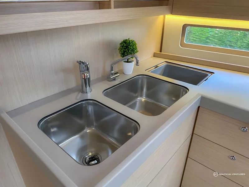 Slide: The Image of Modern kitchen sink area in 2024 Beneteau Oceanis 40.1 yacht. - 39