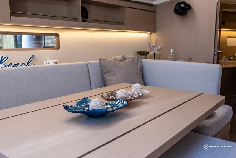 Slide: The Image of Modern interior of 2024 Beneteau Oceanis 40.1 yacht with elegant dining area. - 44