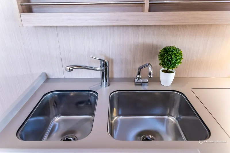 Slide: The Image of Modern kitchen sink area in 2024 Beneteau Oceanis 40.1 yacht. - 48