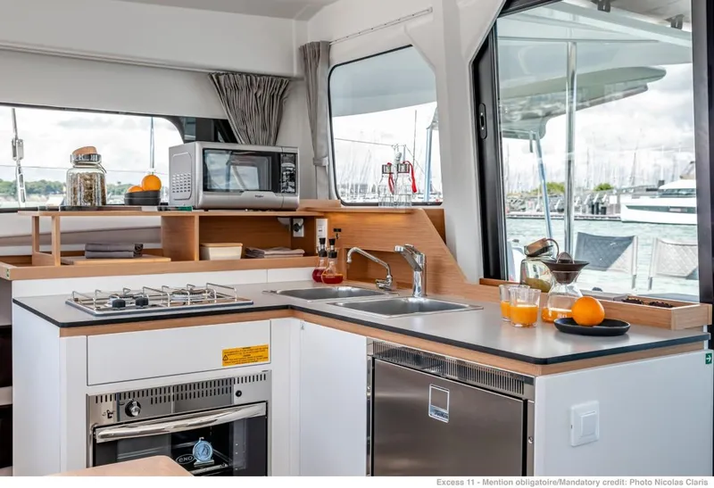 Slide: The Image of Modern kitchen in 2024 Excess 11 yacht with appliances and marina view. - 14