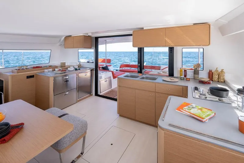 Slide: The Image of Modern kitchen interior of 2024 Excess 14 catamaran with ocean view. - 7