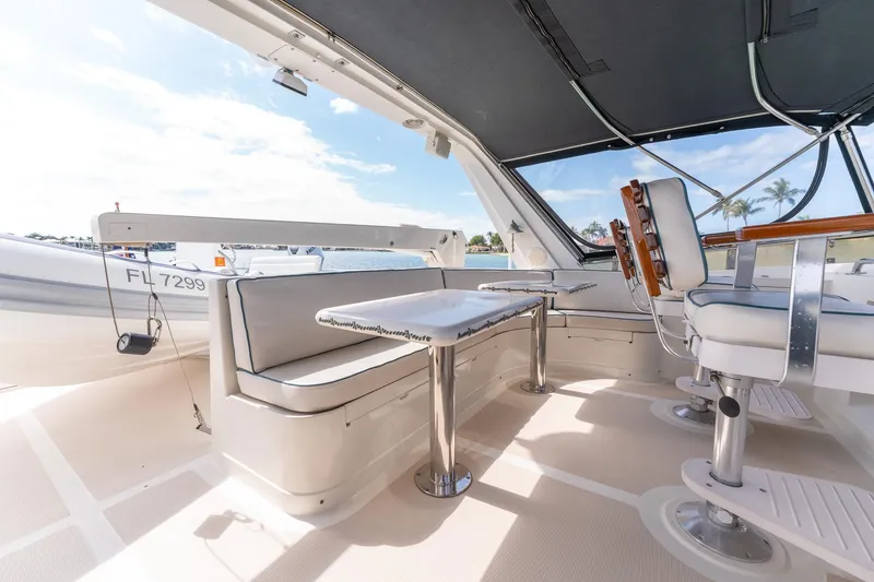 Slide: The Image of 1998 Offshore Yachts 54 Pilot House interior seating and helm area. - 33