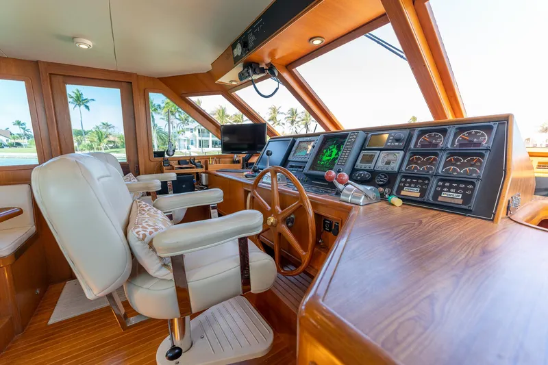 Slide: The Image of Interior helm of 1998 Offshore Yachts 54 Pilot House with navigation equipment and captain's chair. - 39
