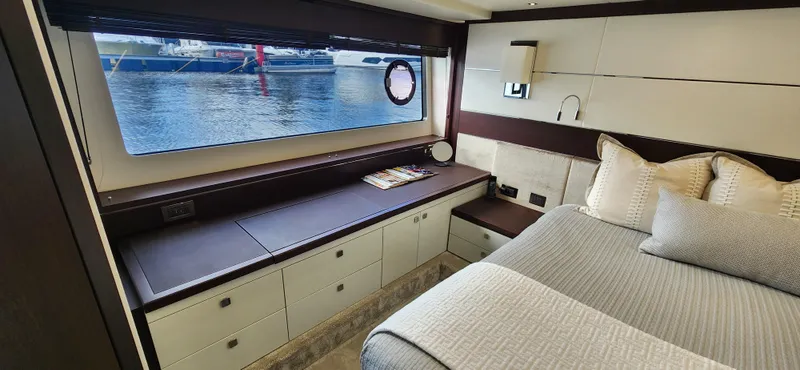 Slide: The Image of Luxurious bedroom interior of 2020 Sunseeker Predator 74 XPS yacht with waterfront view. - 10