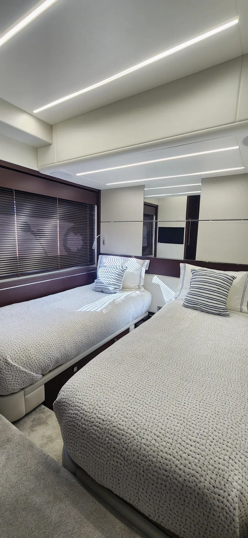 Slide: The Image of Luxurious twin bedroom in 2020 Sunseeker Predator 74 XPS yacht. - 20