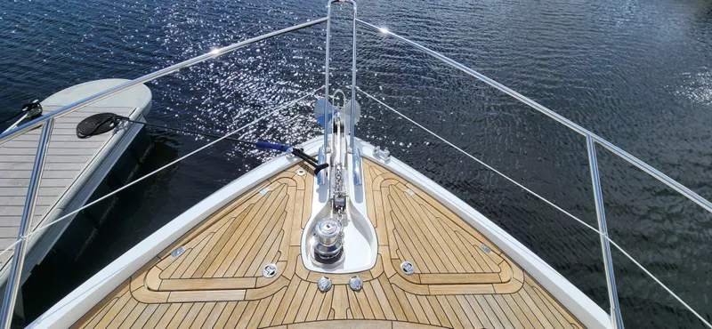 Slide: The Image of Sunseeker Predator 74 XPS 2020 yacht bow with teak deck and stainless steel railings. - 25
