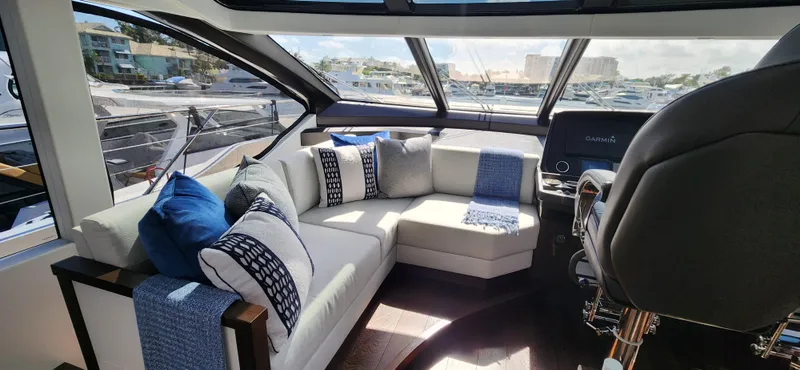 Slide: The Image of Luxurious interior of 2020 Sunseeker Predator 74 XPS yacht with plush seating and scenic views. - 32
