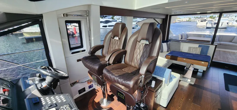 Slide: The Image of Interior of 2020 Sunseeker Predator 74 XPS yacht with luxurious seating and modern controls. - 34
