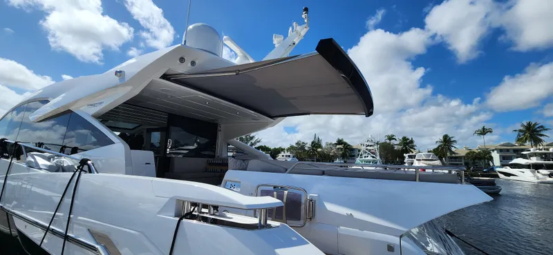 Slide: The Image of Sunseeker Predator 74 XPS 2020 luxury yacht docked at marina under blue sky. - 42