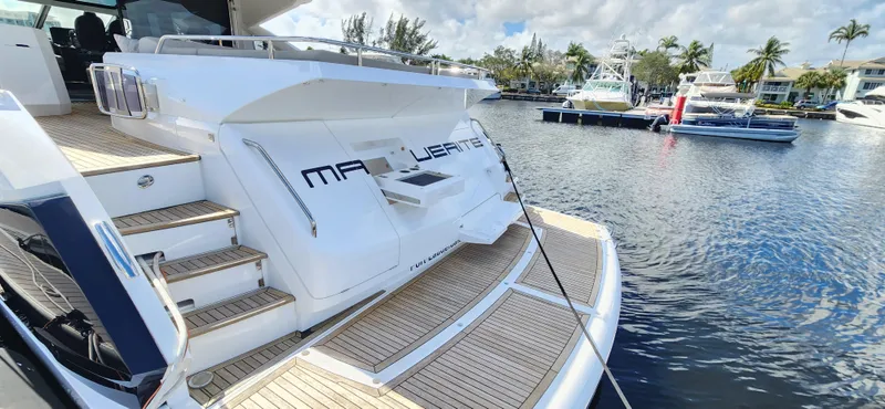 Slide: The Image of 2020 Sunseeker Predator 74 XPS yacht docked at marina, rear view. - 44